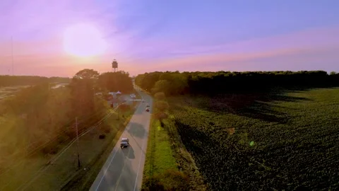 Flying along the road into the sun Stock Footage 142325897