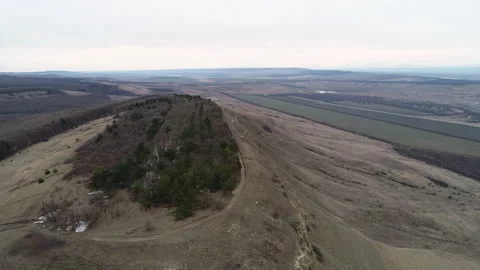 Flying along a small rock with trees Video stock 152981202