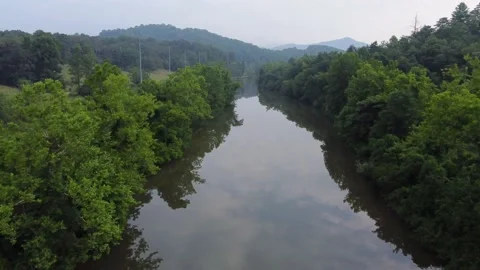 Flying Along a Still River Stock Footage 158325289