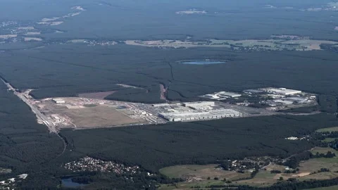 Flying along Tesla Gigafactory 4, a manufacturing plant for Tesla Inc. Stock Footage 342723162