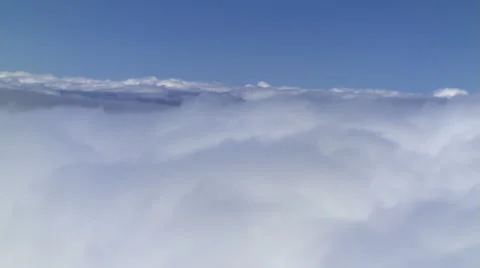 Flying alongside billowing cumulus, passenger POV Stock Footage 59451781
