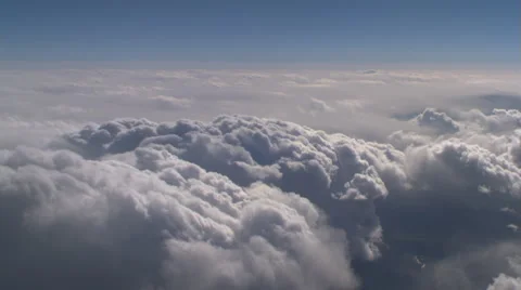 Flying alongside lumpy cloud mass, passenger POV Stock Footage 59450166