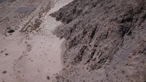 Flying alongside mountain range in the desert Stock Footage 246257150