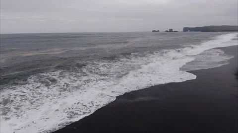 Flying Alongside Seashore At Black Sand Beach in Vík í Mýrdal Iceland 스톡 동영상 64072054