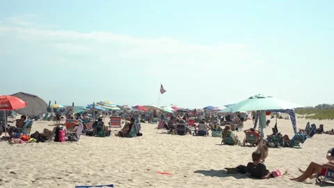 Flying American Flag on beach Stock Footage 140999624