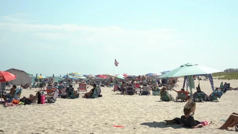 Flying American Flag on beach Stock Footage 140999643