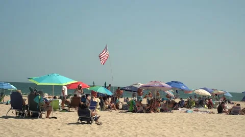 Flying American Flag on beach Stock Footage 140999726
