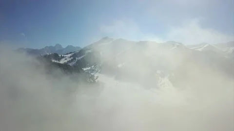 Flying among the clouds in the mountains. Stock Footage 148267328