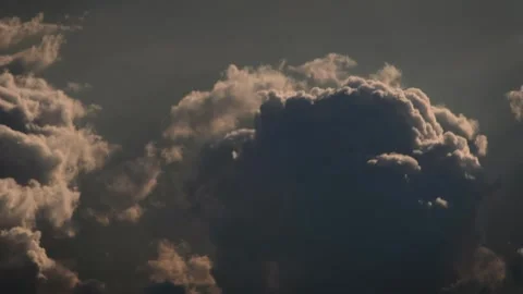 Flying Amongst Fluffy Dark Clouds Stock Footage 265233790