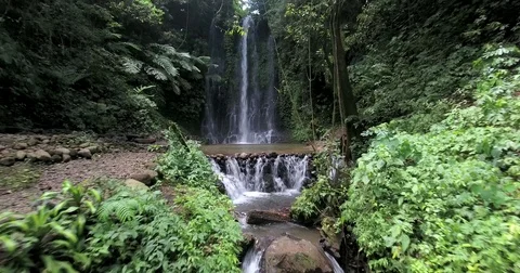 Flying up and around Pucak Manik water fall near Bratan, Bali, Indonesia Stock Footage 73100950