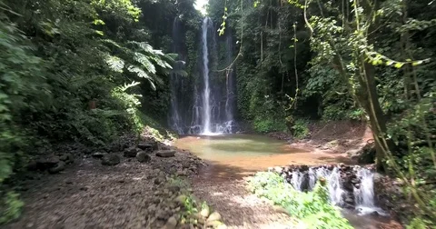 Flying up and around Pucak Manik waterfall near Bratan, Bali, Indonesia Stock Footage 73100976