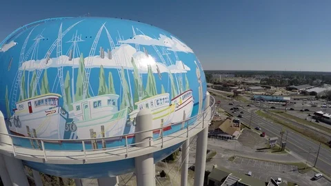 Flying and rotating  CCW around top of water tower showing Panama City sign. Stock Footage 90643838