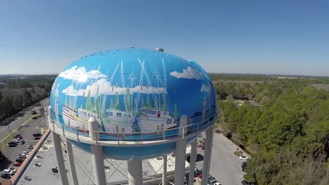 Flying and rotating CW around top of water tower showing Panama City Sign. Stock Footage 90643716