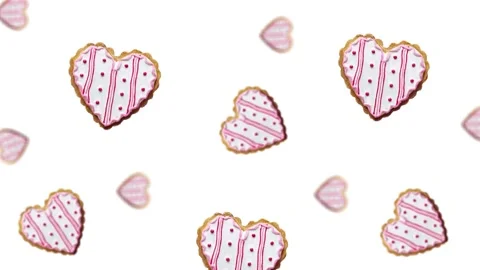 Flying and wiggle of different diameters many hearts shaped gingerbread Stock Footage 168588817