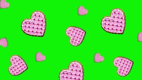 Flying and wiggle of different diameters many hearts shaped gingerbread Stock Footage 168588842