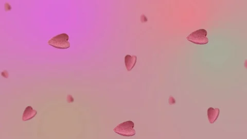 Flying and wiggle of different diameters many pink candy in the shape of heart Video stock 168588889