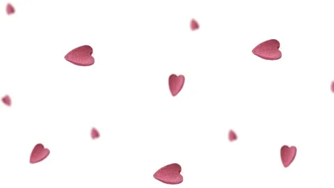 Flying and wiggle of different diameters many pink candy in the shape of heart Stock Footage 168588907