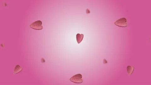 Flying and wiggle of different diameters many pink candy in the shape of heart Stock Footage 168589001