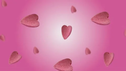 Flying and wiggle of different diameters many hearts shaped gingerbread Stock Footage 168589022