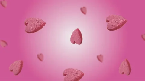 Flying and wiggle of different diameters many hearts shaped gingerbread Stock Footage 168589125