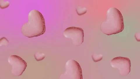 Flying and wiggle of different diameters many heart shaped French macaroons Stock Footage 168619032