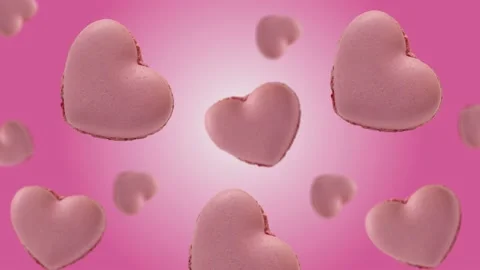 Flying and wiggle of different diameters many heart shaped French macaroons. Stock Footage 168620750