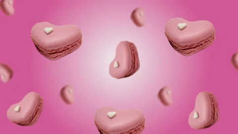 Flying and wiggle of different diameters many pink candy in the shape of heart Stock Footage 168620981