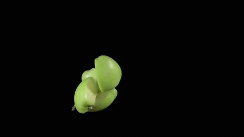 Flying apple pieces on a black background. Organic fruits. Видео 149030572
