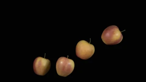 Flying apples on a black background. Organic fruits. 動画素材 148936290