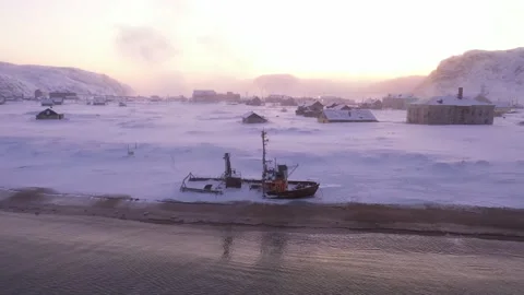 Flying around abandoned ship on Barents sea coast with speed ramp effect Stock-Footage 219757645