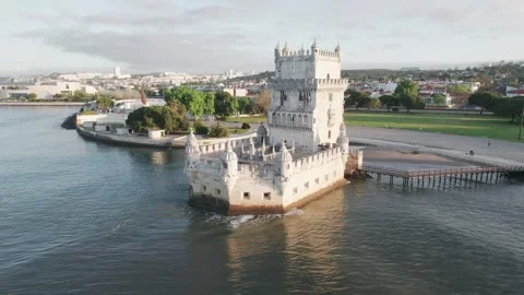 Flying around Belém tower on sunrise Stock Footage 240314680