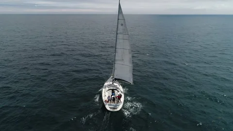  Flying around a boat in full sailing gear. Broad reach sailing in ocean. Stock-Footage 146986084