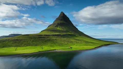 Flying around epic green mountain in Iceland - Kirkjufell - Church Mountain Stock Footage 280112932