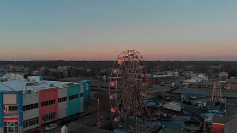 Flying around a Ferrish wheel during sunrise. Stock Footage 87525320