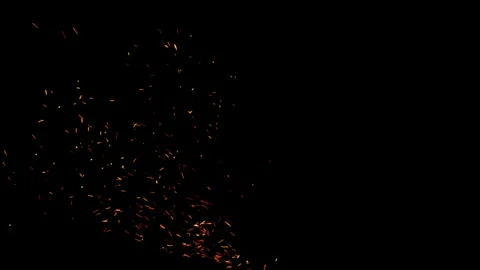 Flying around fire dust particles sparks or ember from a burning fire with r Stock Footage 313214047