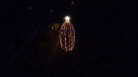 Flying around giant a Christmas tree at night Stock Footage 99521353