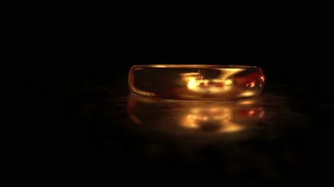 Flying around the gold ring THE LORD OF THE RINGS on the matte glass surface Vidéo 167452707