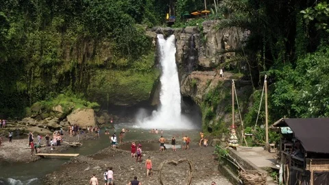Flying around a large waterfall in Bali Indonesia Stock Footage 102533900