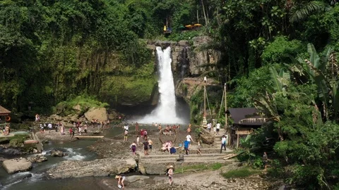 Flying around a large waterfall in Bali Indonesia Stock Footage 102534601