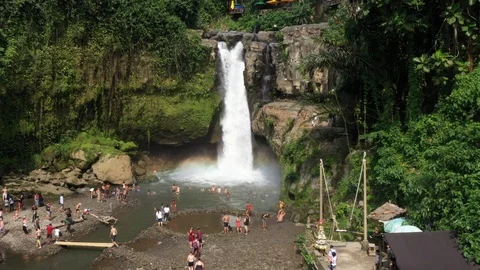 Flying around a large waterfall in Bali Indonesia Stock Footage 102535118