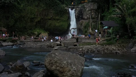 Flying around a large waterfall in Bali Indonesia Stock Footage 102538046