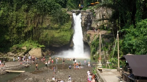 Flying around a large waterfall in Bali Indonesia Video stock 102538788