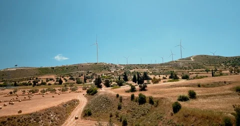 Flying around large wind turbines at ecology power plant on Cyprus. Drone view Video stock 127759537