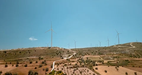 Flying around large wind turbines at ecology power plant on Cyprus. Drone view Video stock 127759962