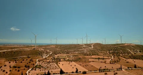 Flying around large wind turbines at ecology power plant on Cyprus. Drone view Stock Footage 127761103