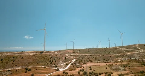 Flying around large wind turbines at ecology power plant on Cyprus. Drone view Video stock 127761283