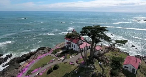 Flying around lighthouse in Crescent City, California Stock Footage 72982243