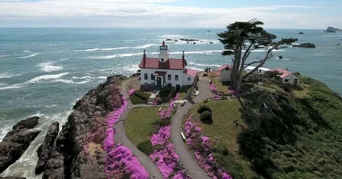Flying around lighthouse at Crescent City, CA Stock Footage 73098730