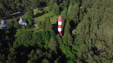 Flying around the lighthouse in the forest Stockbeeldmateriaal 162957708
