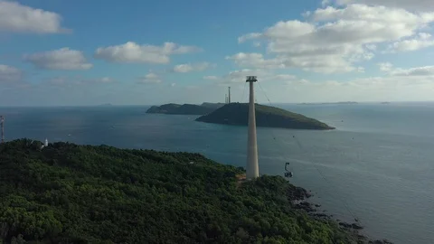 Flying around longest cable car in horizon line below cloudy sky in Phu Quoc isl Stock Footage 124366235